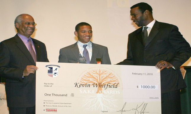 Commissioner Hayward Benson, Kevin Whitfield, & Irvin Kiffin with Check