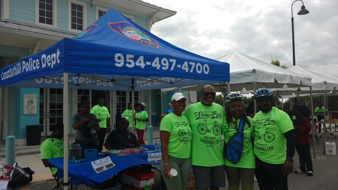 city Officials and Officers by LPD booth during Slow Roll event 