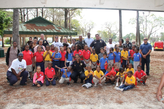 Group picture of LPD Officers and participating kids together during Safety Town