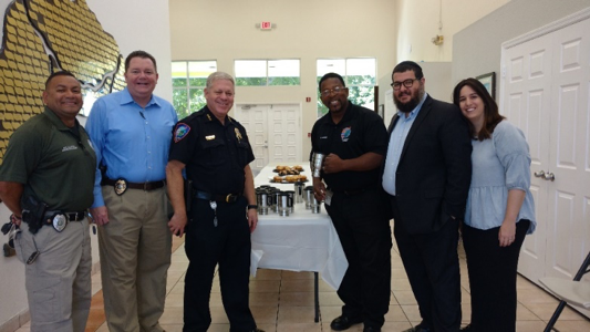 Lauderhill Police officers with Synagogue of Inverrary Chabad members having coffee, cookies and muffins. 