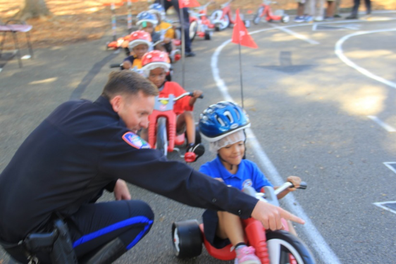 Officer directing students during Safety Town activity