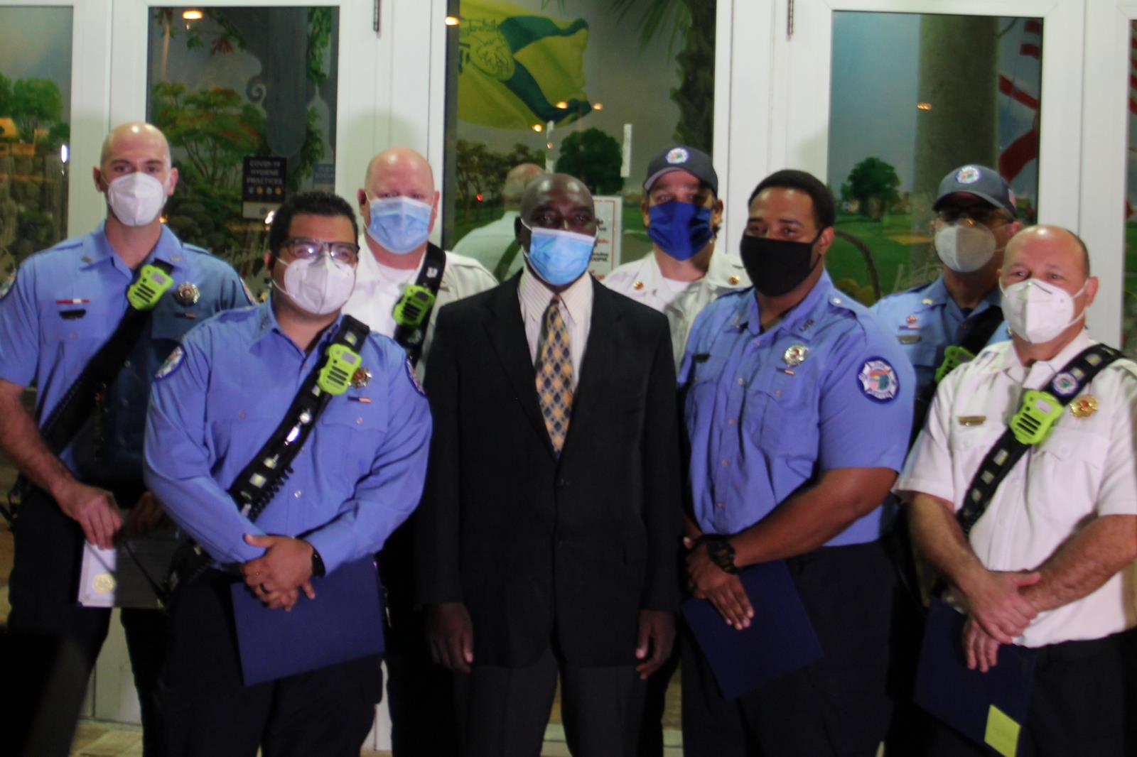 Lauderhill fire rescue and Nerosier Valcy outside Lauderhill Commission Chambers