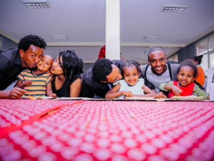 parents with children at school table