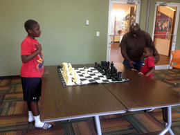 Youth Chess Players with Board